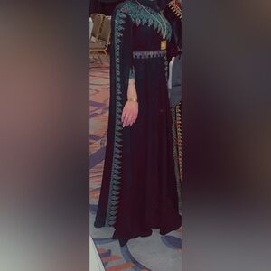 Elegant Black and Green Embroidered Dress
Falahi thoub